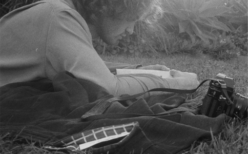 Black and white man lying in grass