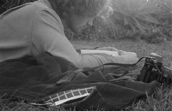 Black and white man lying in grass