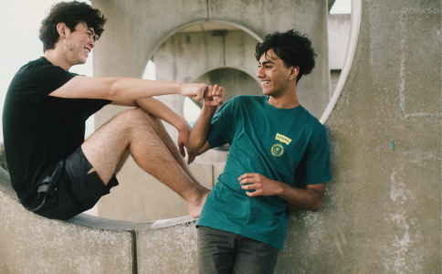 Fist bump two male friends