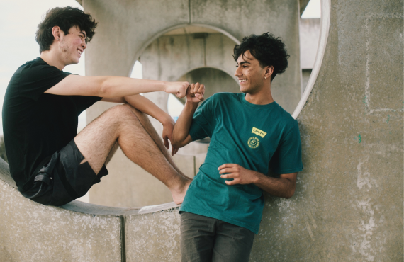 Fist bump two male friends