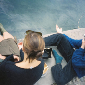 Young man and woman on dock