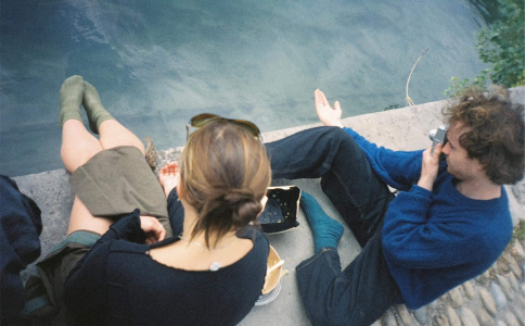 Young man and woman on dock