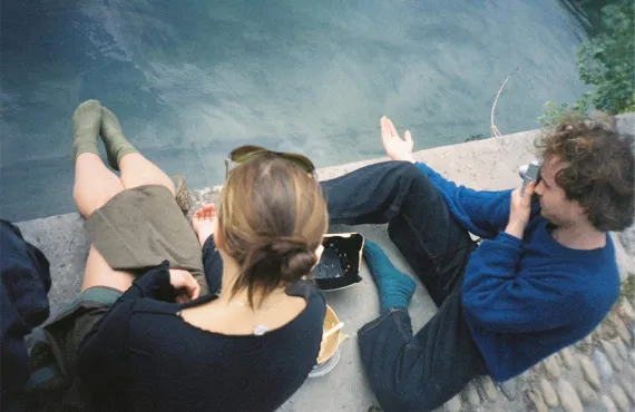 Young man and woman on dock